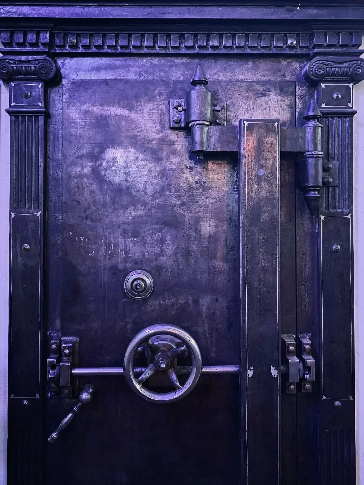 a metal door with a handle and a lock on it